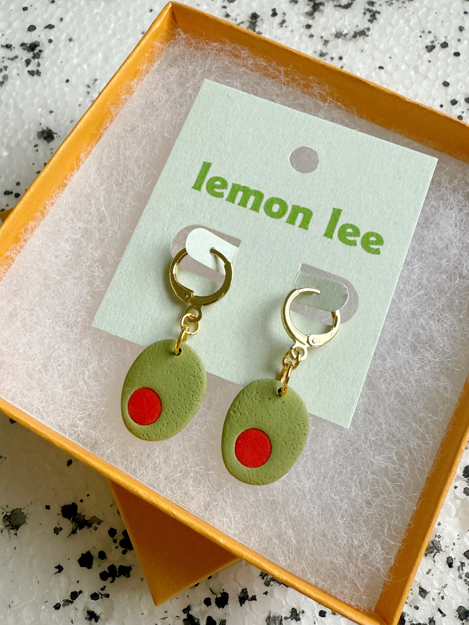 olive huggie earrings