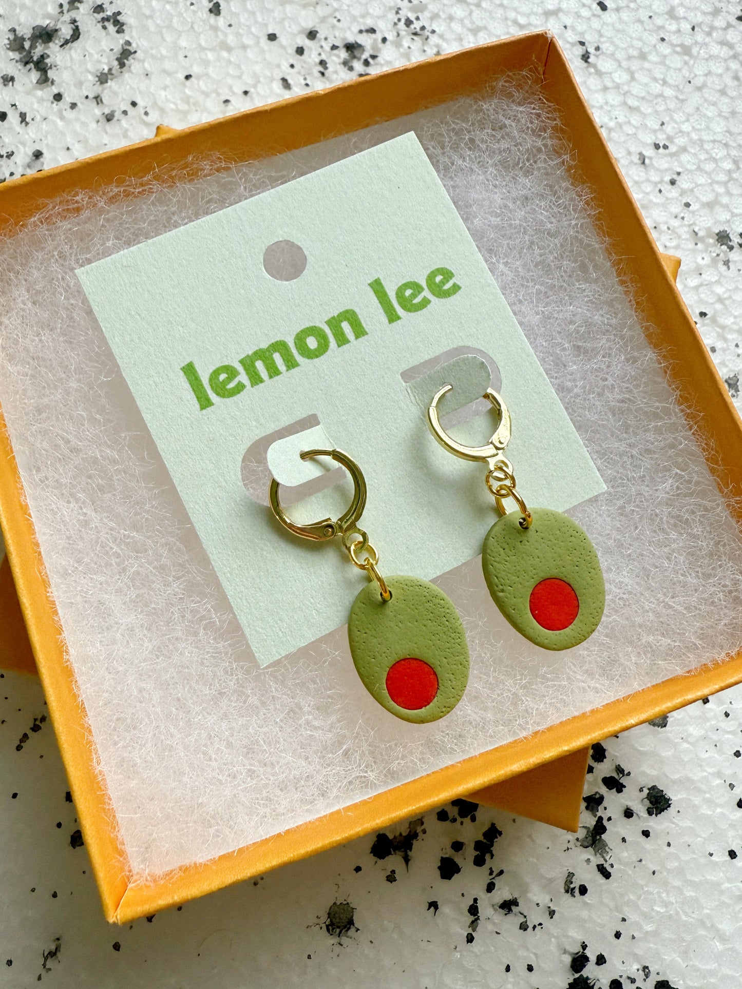 olive huggie earrings