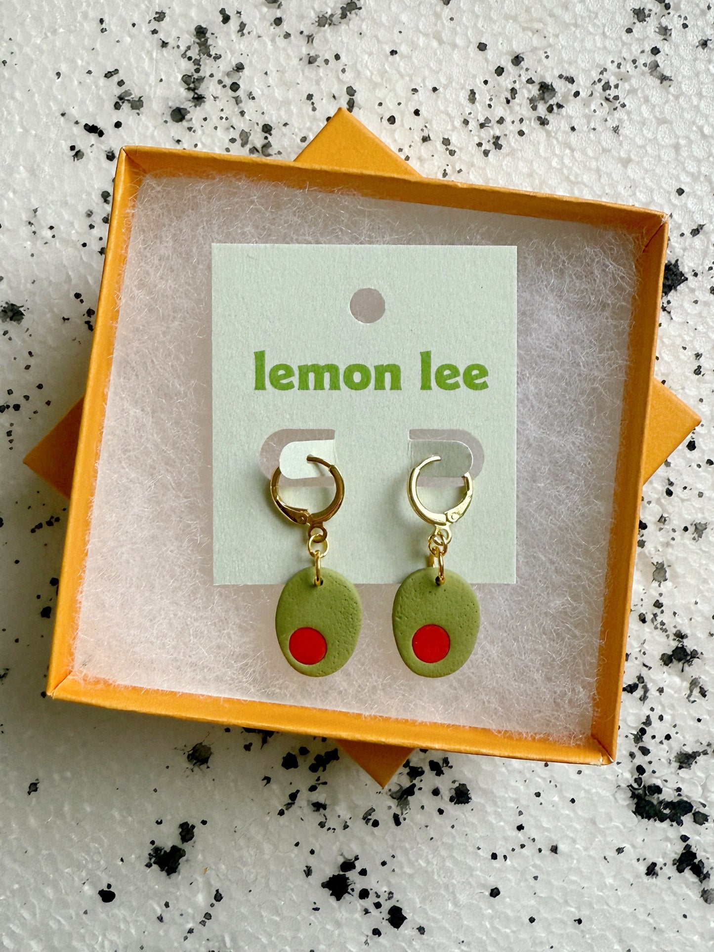 olive huggie earrings